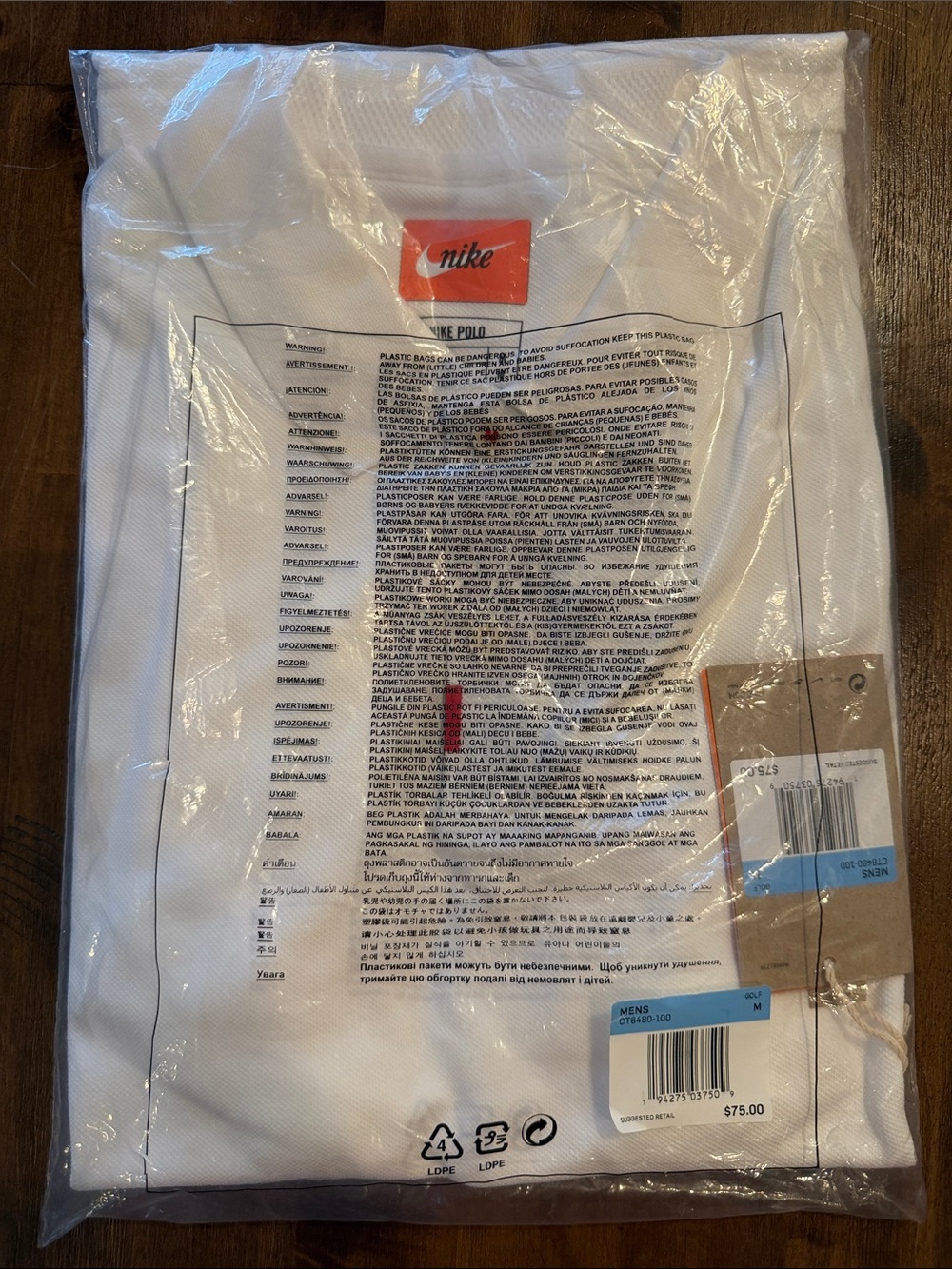 Nike White Polo Shirt with Orange Logo Tag